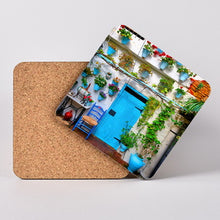 Load image into Gallery viewer, Beautiful courtyard in Córdoba, Spain. Hardboard Coaster with Cork Back